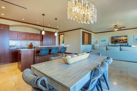 Enjoy island breezes at the lanai with kitchen view