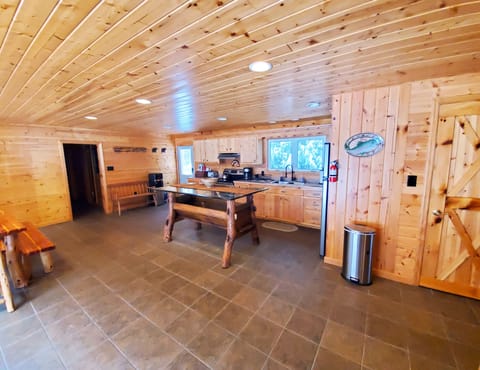 Kitchen and dining between the den and bedroom areas