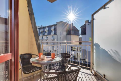 The living area opens up to a balcony, perfect for enjoying the nice vievs and air.