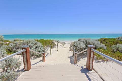 On the beach, white sand, beach towels