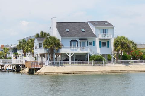 Waterfront home with an elevated deck at Mistral Channel Home, a 4-bedroom Cherry Grove vacation rental