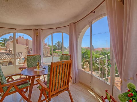 Plant, Property, Furniture, Building, Table, Window, Wood, Chair, Houseplant, Shade