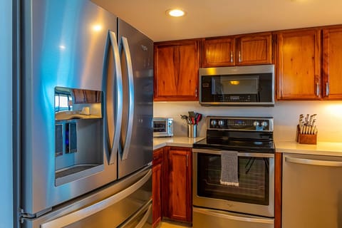 Stainless steel appliances in the beautiful kitchen. 