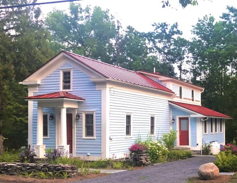 Creekside Greek Revival cottage.