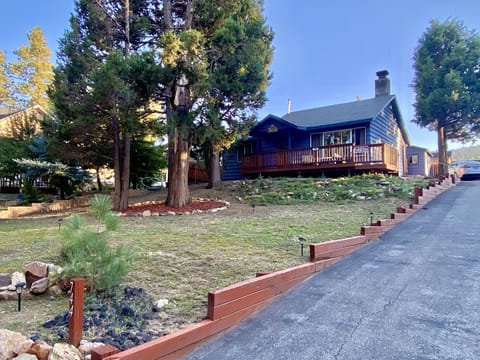 Front view of Chalet from street level. Long driveway with parking