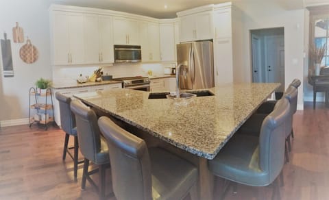 Kitchen island, large fridge, stove, dishwasher