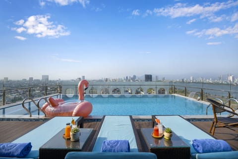 Outdoor pool, open 6:00 AM to 10:00 PM, free cabanas, pool umbrellas