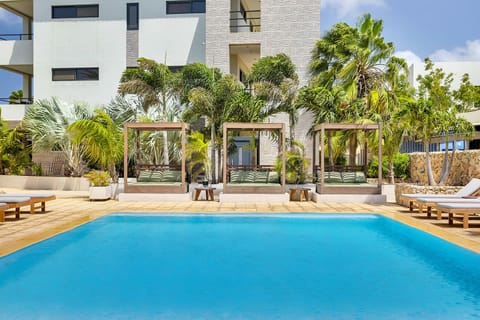 Outdoor pool, open 8:00 AM to 8:00 PM, free cabanas, sun loungers