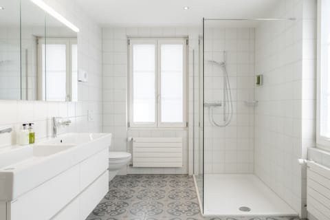 Separate tub and shower, designer toiletries, hair dryer, bathrobes