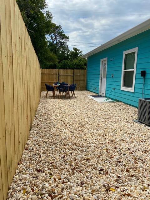 Outdoor dining area, fenced in yard, outdoor shower, 3 burner propane grill 