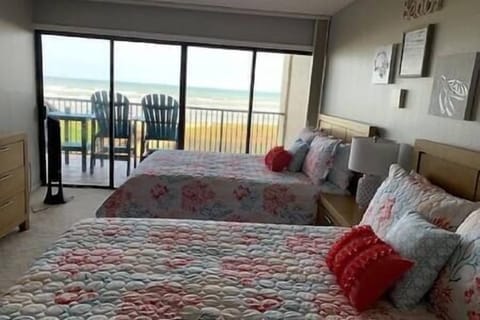 Master bedroom view with double queen beds