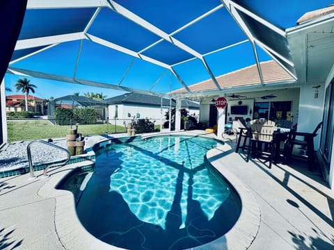 Caged Lanai with Free form heated pool  