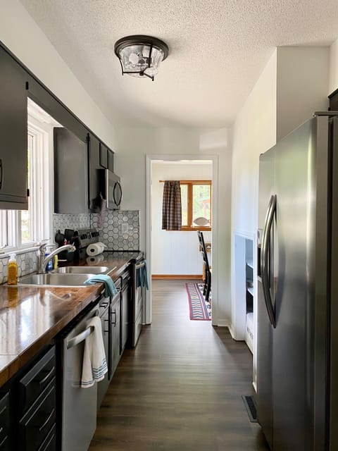 Newly upgraded kitchen with storage, dish washer and large refrigerator.