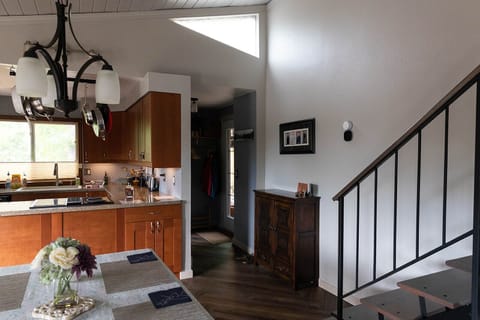 Interior open staircase, entryway, kitchen/dining open concept