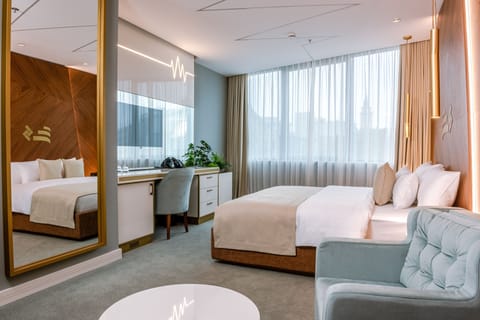 Superior Double Room | Minibar, in-room safe, desk, blackout drapes