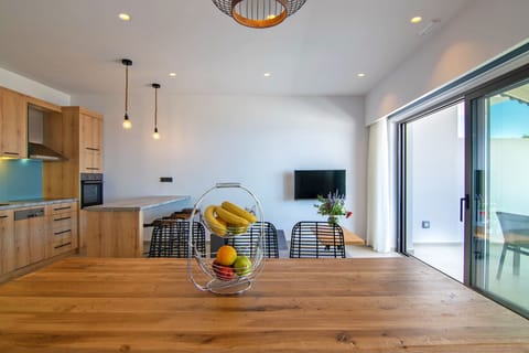 Fully equipped kitchen and dining area of Spectacular Sea View Villa,Near Taverns & Sandy Beaches