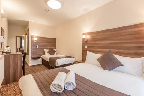 Standard Triple Room | Select Comfort beds, in-room safe, individually decorated
