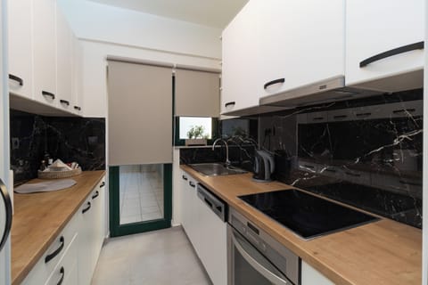 Deluxe Apartment, 2 Bedrooms, Sea View | Private kitchen | Full-size fridge, oven, stovetop, coffee/tea maker