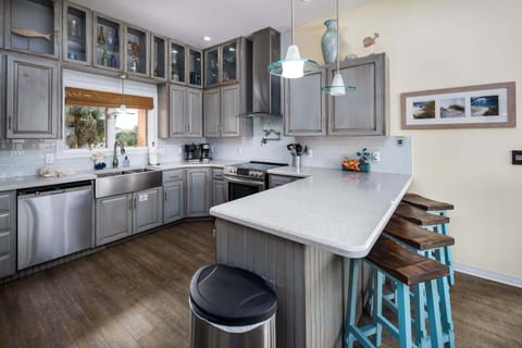 Fully stocked kitchen with breakfast bar