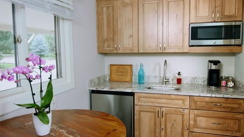 Mini Kitchen with fridge, microwave, one induction burner, toaster, k-cup coffee maker with k-cups, sugar and cream