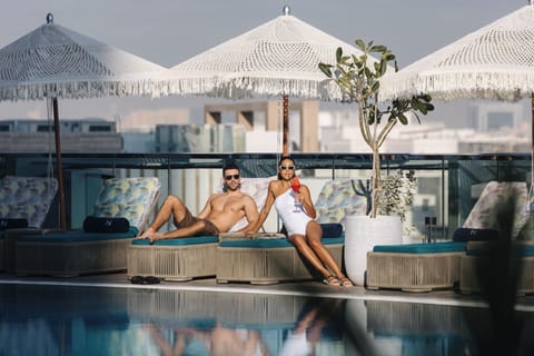 Outdoor pool, pool umbrellas, sun loungers