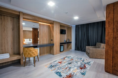 Executive Suite, Garden View, Corner | Living area | LCD TV