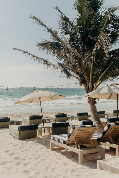 Private beach, white sand, free beach cabanas, beach umbrellas