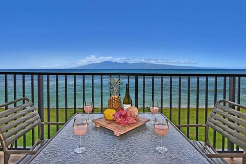 Sip wine on a balcony with ocean views.