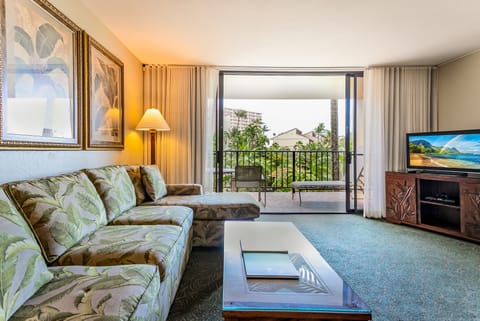 Your tropical escape awaits with breezy island decor, a private balcony overlooking swaying palms and ocean views, and all the comforts for total relaxation.