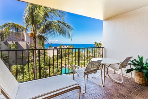 Step onto your private balcony and soak in stunning ocean views framed by swaying palms. Unwind with morning coffee or sunset cocktails in your cozy outdoor seating area.
