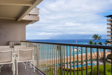 Stunning beachfront balcony overlooking turquoise waters, golden sand, and neighboring islands. Enjoy morning coffee with tropical breezes and panoramic ocean views from your private outdoor retreat.