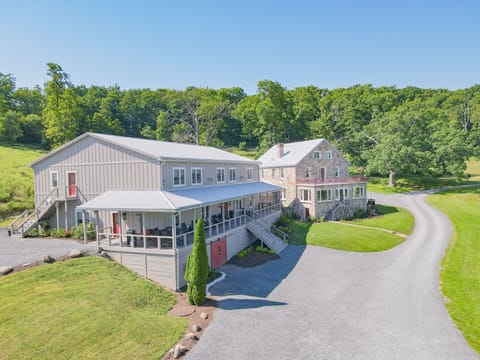 Inn is the larger building to the left. Stone House is a separate rental.