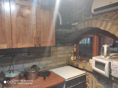 Luxury Triple Room, Garden View | Shared kitchen | Coffee/tea maker, electric kettle