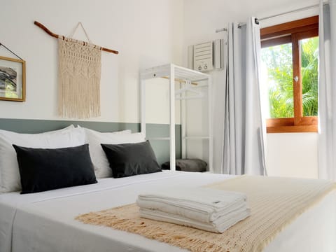 Standard Suite, 1 Queen Bed | Iron/ironing board, individually decorated, bed sheets