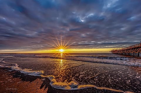 Welcome to our happy place where there is a beautiful sky above, soft, sand below, and oh, we are located right across the street from the ocean.  Most of our  reviews speak of our amazing proximity to the beach.