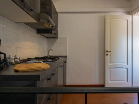 Flooring, Kitchen, Countertop, Wood, Interior Design, Kitchen Appliance, Floor, Major Appliance, Cabinetry, Room