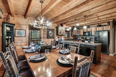 Door leads to BBQ, screened porch for added dining options, and hot tub