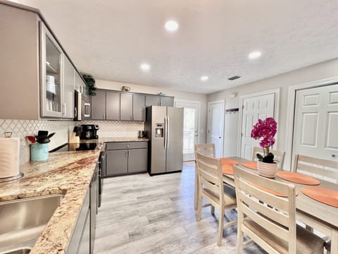 Kitchen area with RO water dispenser. 