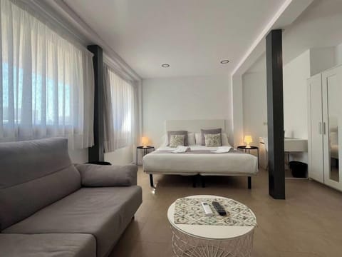 Family Studio, Multiple Beds | Living area | 32-inch flat-screen TV with satellite channels