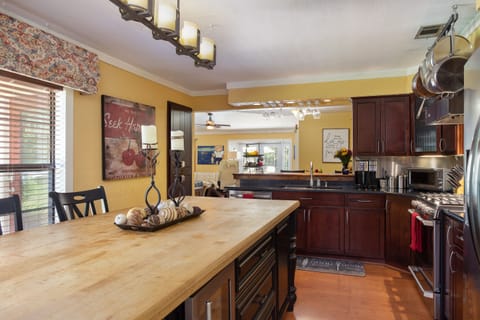 Open floor plan keeps everybody in the action, plus TV in the kitchen.