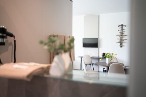 Business Triple Room | Living area | 32-inch flat-screen TV with satellite channels, TV, first-run movies