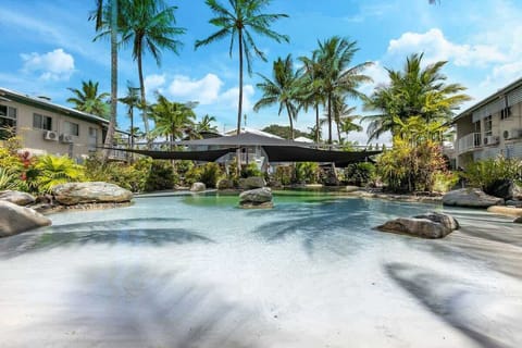 Cool off in the resort’s lagoon-style pool, complete with a sandy beach edge, tropical landscaping, and inviting spaces to relax in the sun.