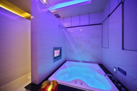 Separate tub and shower, hair dryer, slippers, towels