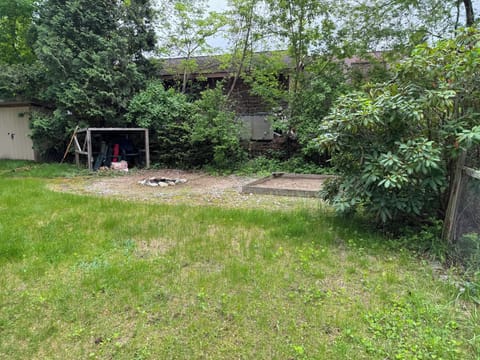 Side yard, sandbox & fire pit