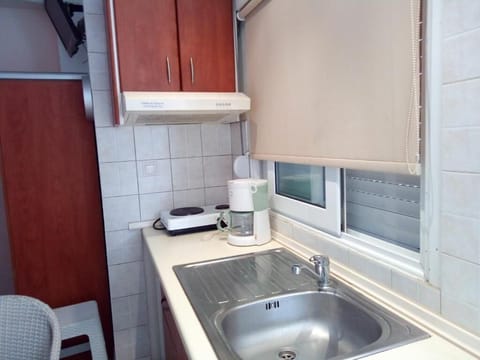 Basic Quadruple Room | Blackout drapes, iron/ironing board, free WiFi, bed sheets