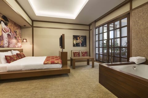 Suite, 1 King Bed, Non Smoking (Garden) | Minibar, in-room safe, desk, iron/ironing board