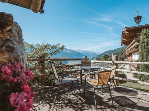 Sky, Furniture, Plant, Flower, Azure, Building, Table, Chair, Flowerpot, Wood
