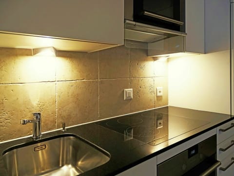 Countertop, Kitchen, Cabinetry, Property, Room, Sink, Tile, Lighting, Under-Cabinet Lighting, Light Fixture