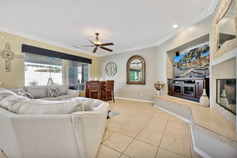 Mix up a few dirty martinis at the mobile bar while you watch the game on the 65-inch Samsung Smart Television