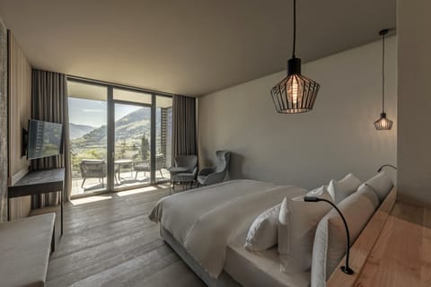 Premium bedding, down comforters, pillowtop beds, free minibar